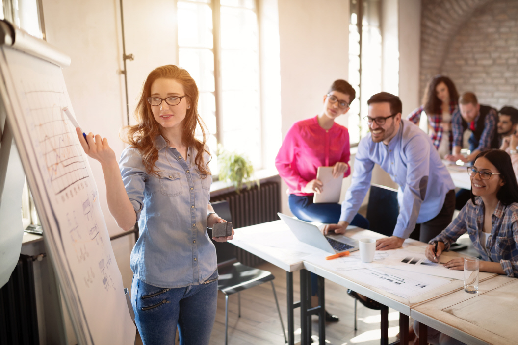 Group of co-workers in an office taking part in training